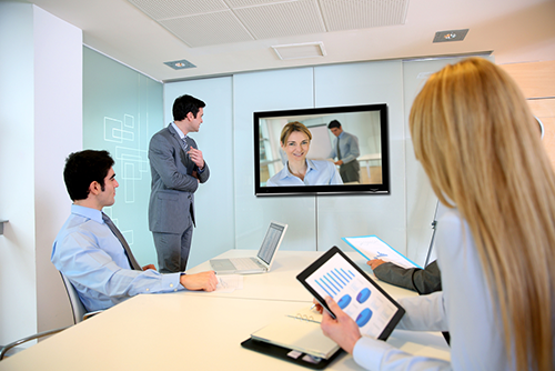 Business people attending videoconference meeting-500